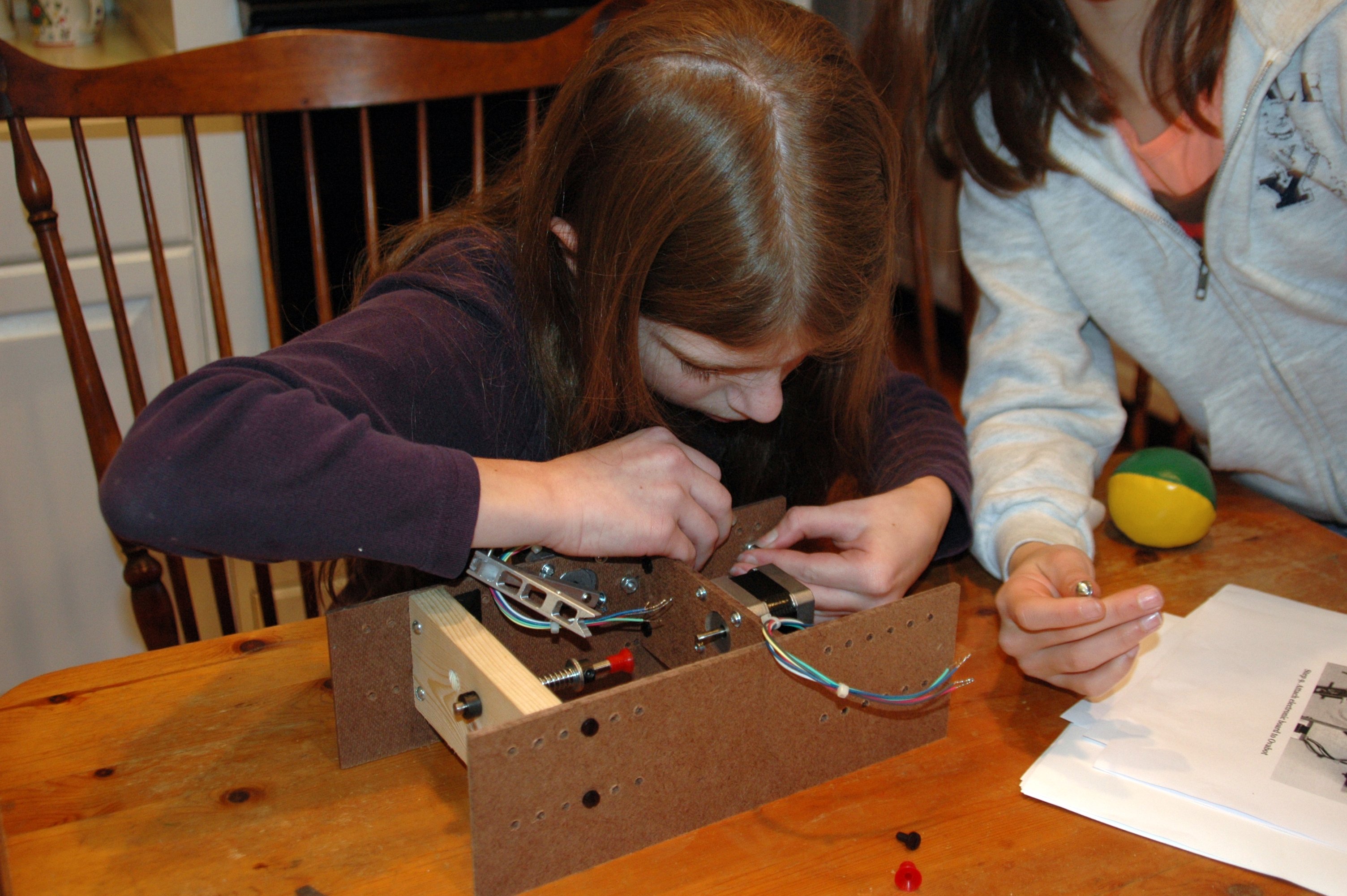 Kids assembling ovabot